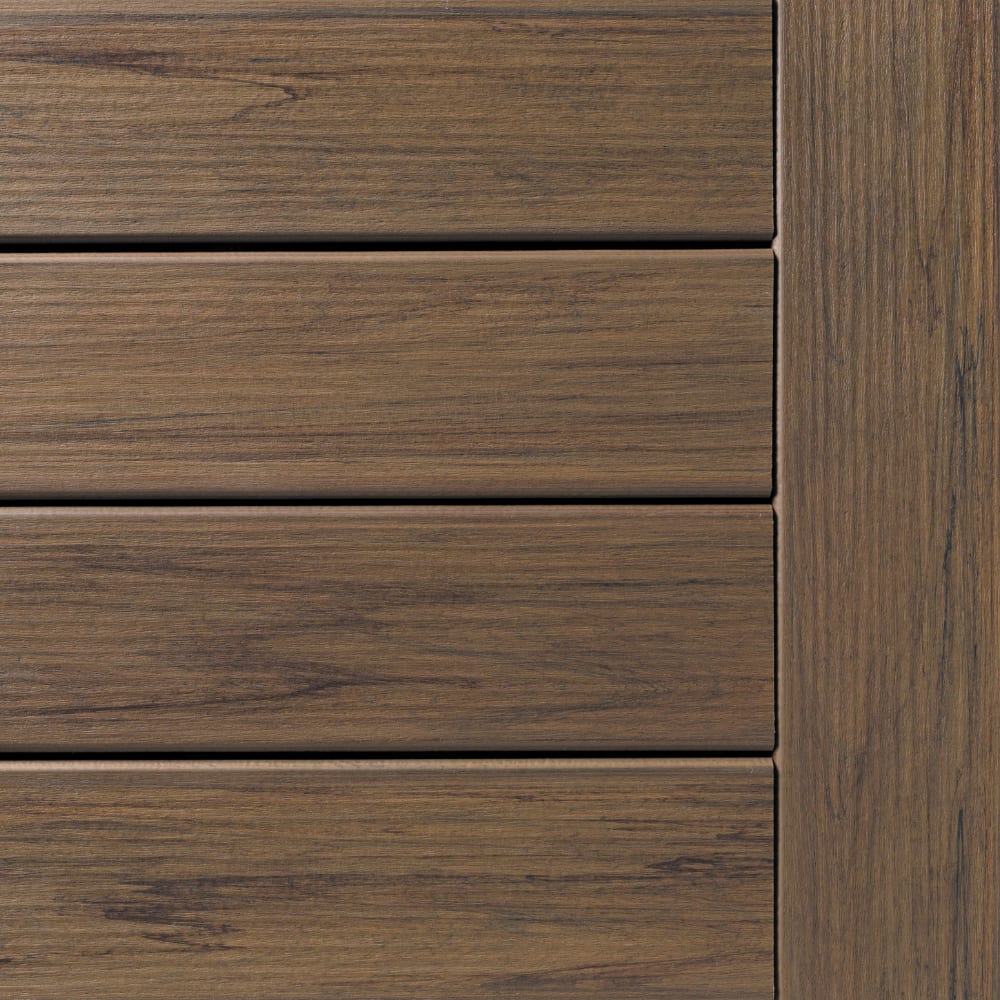 Legacy Pecan composite decking with horizontal slats and a vertical trim piece in matching wood grain.