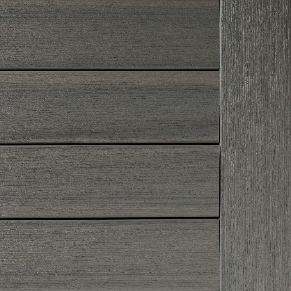 Prime Sea Salt Gray composite decking with horizontal planks and vertical edge detail.