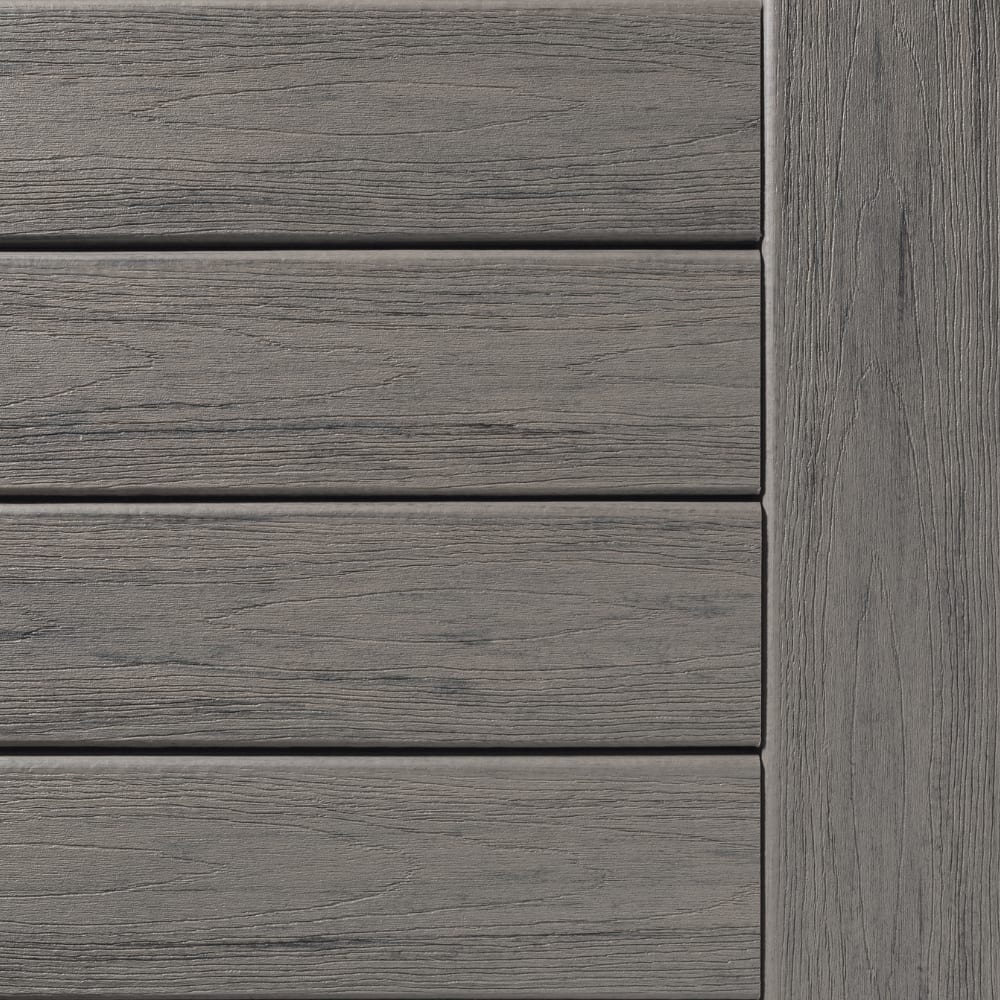 Gray TimberTech Reserve Driftwood composite decking with visible wood grain texture and plank seams.