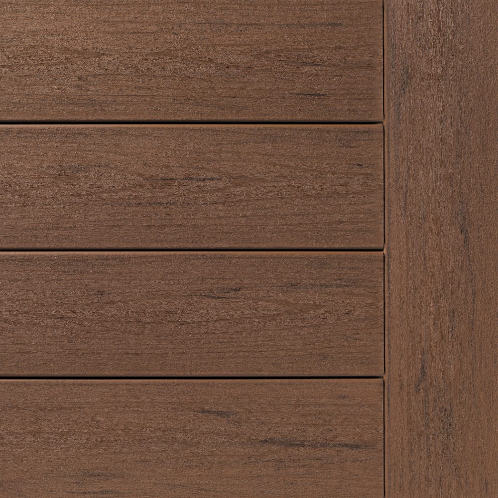 Brown oak composite decking with horizontal planks and a vertical edge panel, showcasing realistic wood grain texture.
