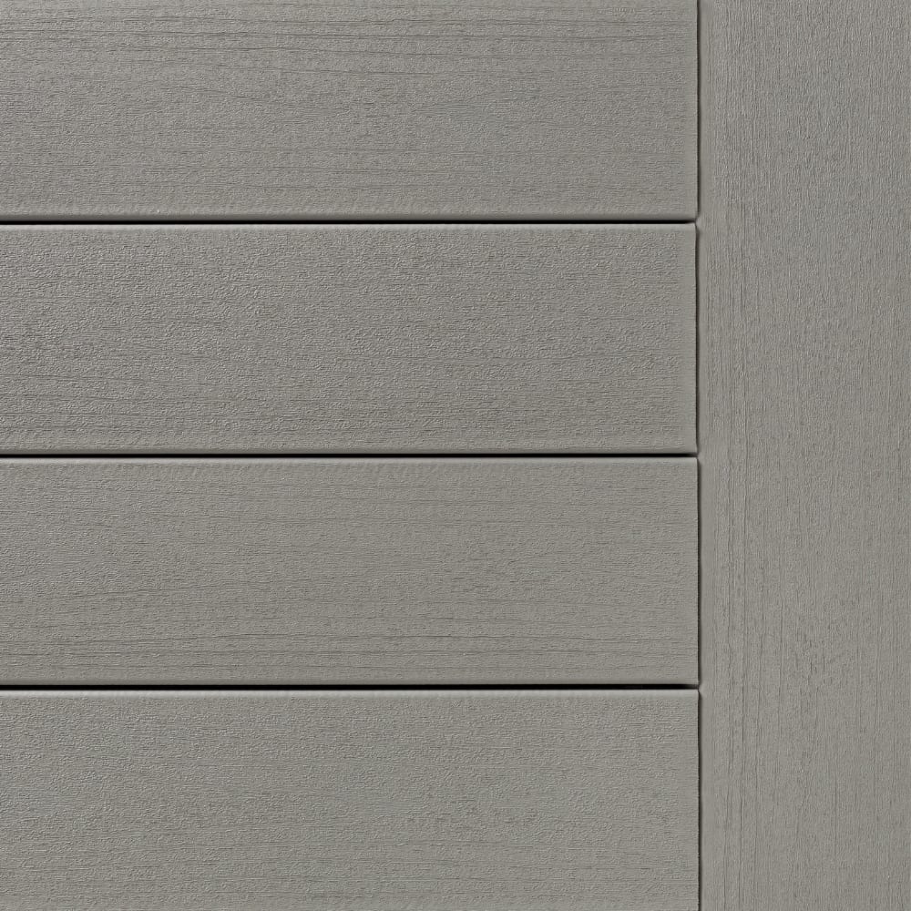 Gray Terrain Stone Ash Composite siding boards with horizontal grooves and a vertical corner panel.